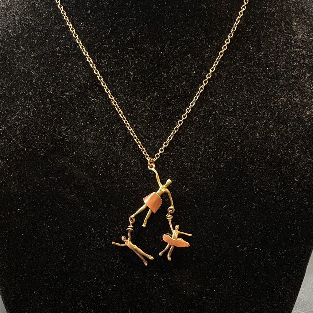 Gold Tone Necklace with Dancing Figures Pendant